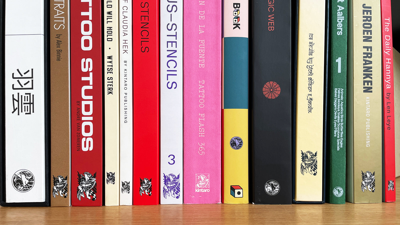 Stack of Kintaro tattoo books on a studio desk